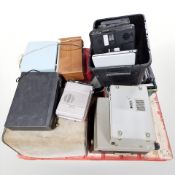 A group of portable record players, radios, laptops, etc.