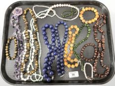 A group of polished beads and necklaces, Lapis,