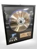 A The Beatles Abbey Road gold plated vinyl disc, numbered 20 of 40, 54 cm x 44 cm.