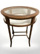 A reproduction oval bijouterie table,