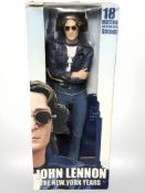 A Neca John Lennon The New York Years figurine, in original box, height 48 cm.