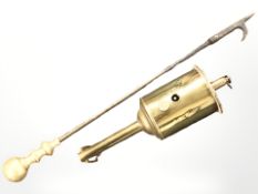 A brass spit jack and a fire poker