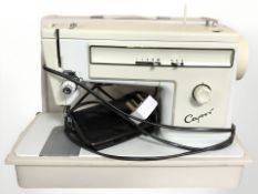 A Capri electric sewing machine with lead and pedal.