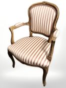 Two continental carved beech salon armchairs