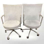 A pair of Danish Erik Jorgensen designed 'Partner' chrome-framed executive swivel armchairs,