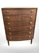 A 20th century Danish teak and pine bow front six drawer chest, 80 cm W x 45 cm D x 111 cm H.