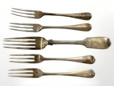 Four Victorian silver cake forks, together with an Irish silver table fork, Dublin, 1870.