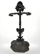 A painted metal stick stand, height 60 cm.