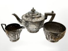 A three piece silver bachelor's tea service, Sheffield 1910. CONDITION REPORT: 476.