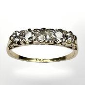 An 18ct gold five stone old-cut diamond ring, the total diamond weight estimated at 0.