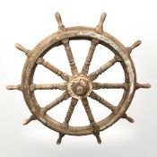A large ship's wheel, circa 1900,