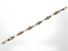 A 9ct yellow gold bracelet set with synthetic aquamarine, length 18.