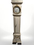 A continental cream and gilt long case clock, with pendulum and weights, height 207 cm.