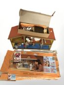 A Lundby doll's house containing various furniture.