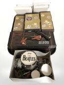 A miniature The Beatles drum kit and a quantity of Atlas Editions miniature electric guitars,