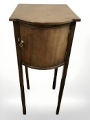 An Edwardian mahogany bow front pot cupboard, width 31 cm.