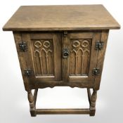 A 20th century oak double door low cabinet, 51 cm wide.