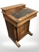 A Victorian figured walnut and satin inlaid Davenport,