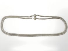 A pair of Sterling silver smooth link necklaces each with magnet clasp,