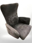 A Scandinavian swivel lounge chair in suede fabric on aluminium support, width 90 cm.