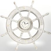 A quartz timepiece in the form of a ship's wheel,