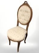 A continental carved oak framed chair and a further salon chair