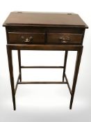 A 20th century mahogany clerk's writing stand, 77 cm W x 56 cm D x 115 cm H.