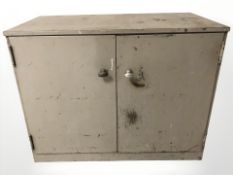 A 20th century enamelled metal double door low cabinet,