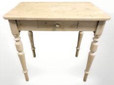 An early 20th century pine side table fitted a drawer,