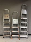 Three aluminium step ladders