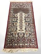 A machined Persian-design rug,