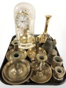 An anniversary clock under dome, several chamber sticks, bells, etc.