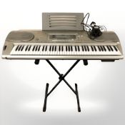 A Casio WK-3300 digital keyboard on stand with lead