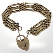 A 9ct gold padlock bracelet CONDITION REPORT: 17.