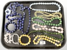A group of polished beads and necklaces,
