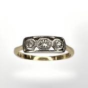 An 18ct gold and platinum three stone old-cut diamond ring,
