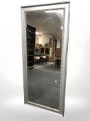 A contemporary silvered rectangular mirror,