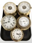 A group of brass cased ship's instruments including a Schatz barometer and a similar timepiece, etc.