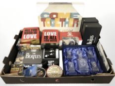 The Beatles - A group of collectibles including mugs, decanter and glass set, tins, etc.