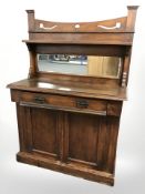 An Arts & Crafts walnut mirror backed sideboard,
