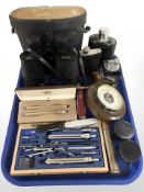 A pair of Falcon 7x50 binoculars, circular barometer, precision drawing set, Swiss army knife,