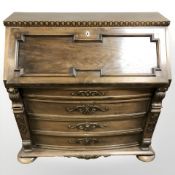 A 20th century continental oak bureau, 107 cm W x 49 cm D x 108 cm H.