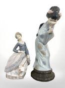 A Lladro figure of a girl holding a parasol and another of a geisha, height 26.5 cm.
