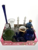 A group of crystal decanters, assorted coloured glass bottles and vessels.