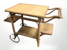 A 20th century wicker trolley, length 94 cm.