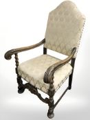 An early 20th century carved oak open armchair,