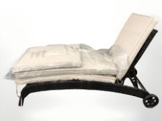 A woven plastic garden steamer longer with cushion