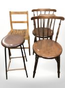 A pair of beech spindle back chairs, a further pair and a stool.