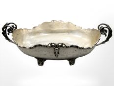 A continental white metal twin-handled centrepiece, width 38.5cm.