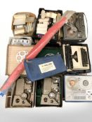 A group of reel to reel players, Olympia typewriter, projectors, similar equipment.